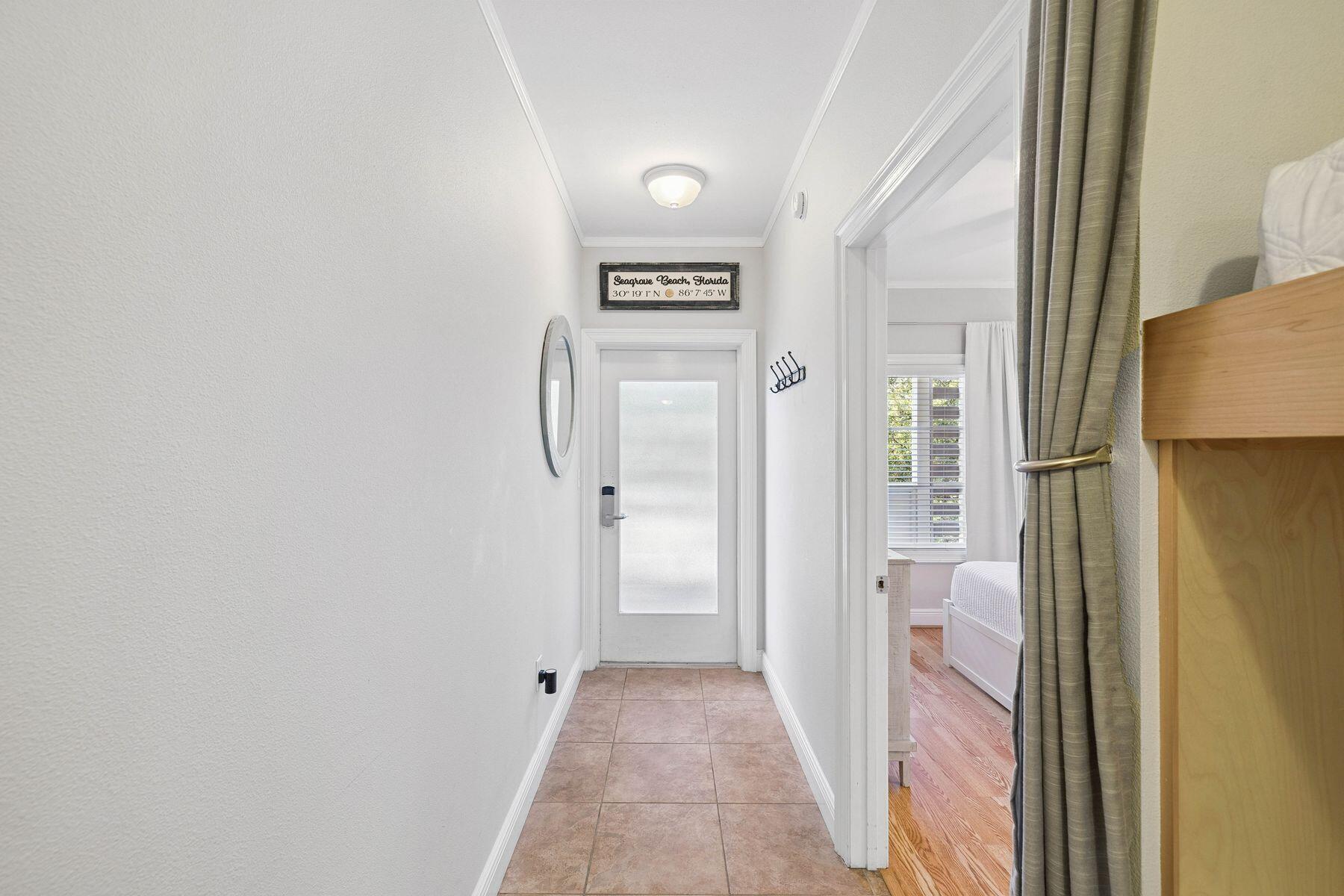 43 Cassine Way, Unit 207 Santa Rosa Beach, FL 32459 - Photo 10 of 28 a view of a hallway with a refrigerator