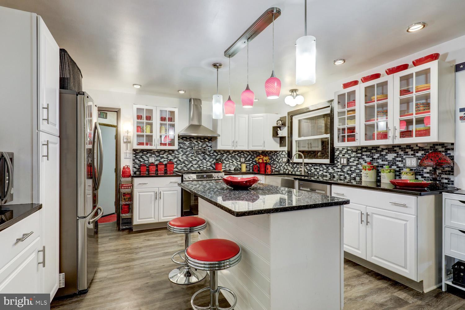 912 Perry Road Lititz, PA 17543 - Photo 11 of 50 a kitchen with granite countertop a sink stove and cabinets