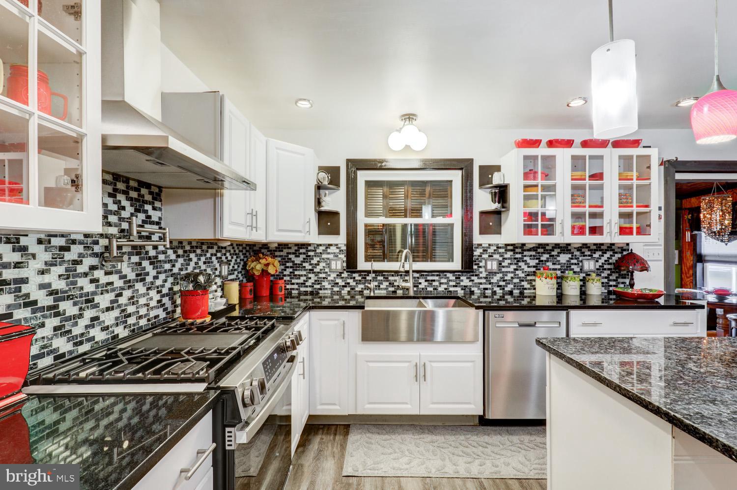 912 Perry Road Lititz, PA 17543 - Photo 12 of 50 a kitchen with stainless steel appliances granite countertop a stove and a sink