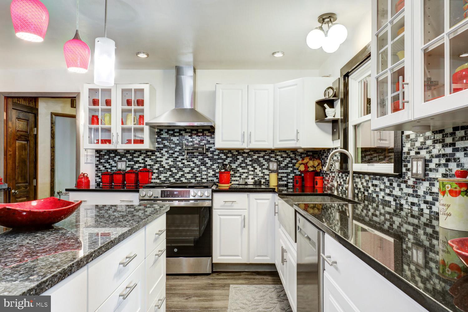 912 Perry Road Lititz, PA 17543 - Photo 16 of 50 a kitchen with stainless steel appliances kitchen island granite countertop a sink and cabinets