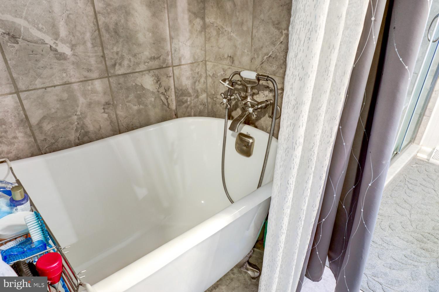 912 Perry Road Lititz, PA 17543 - Photo 26 of 50 a bathroom with a bathtub and shower