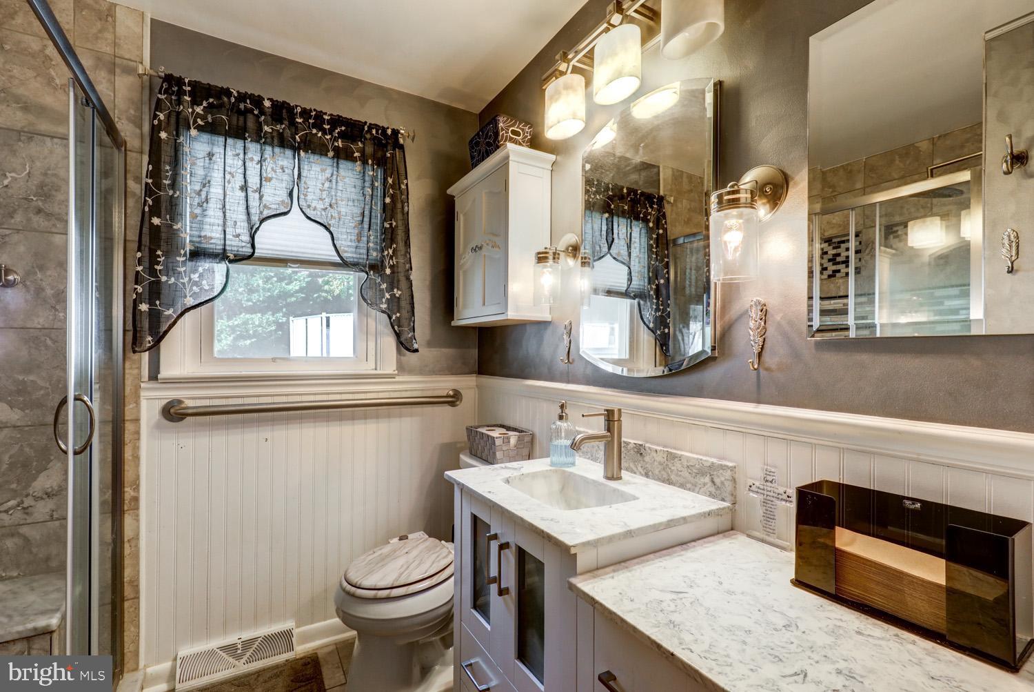 912 Perry Road Lititz, PA 17543 - Photo 27 of 50 a bathroom with a granite countertop toilet sink and mirror