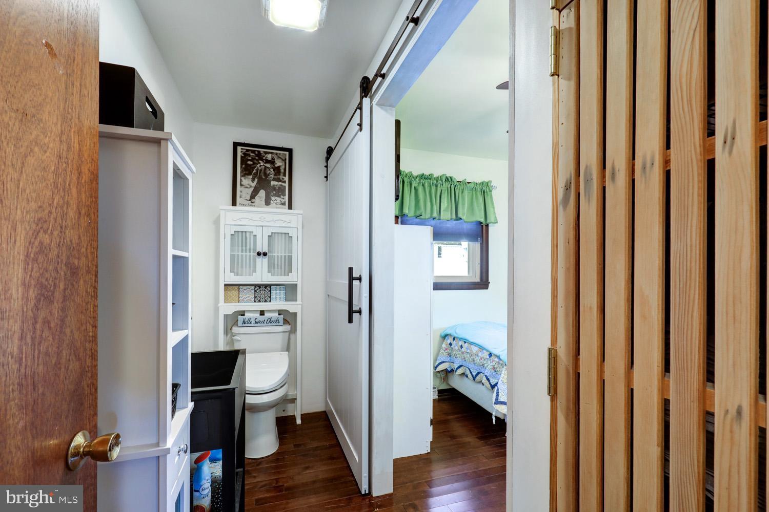 912 Perry Road Lititz, PA 17543 - Photo 29 of 50 a view of a hallway with wooden floor and workspace