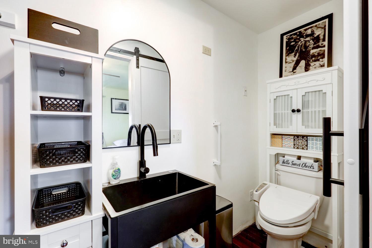912 Perry Road Lititz, PA 17543 - Photo 30 of 50 a bathroom with a toilet a sink and mirror