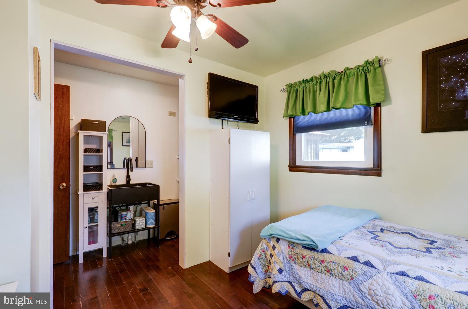 912 Perry Road Lititz, PA 17543 - Photo 32 of 50 a bedroom with a bed and a flat screen tv