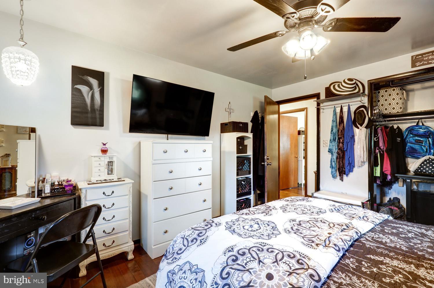 912 Perry Road Lititz, PA 17543 - Photo 34 of 50 a bedroom with a bed and a flat screen tv