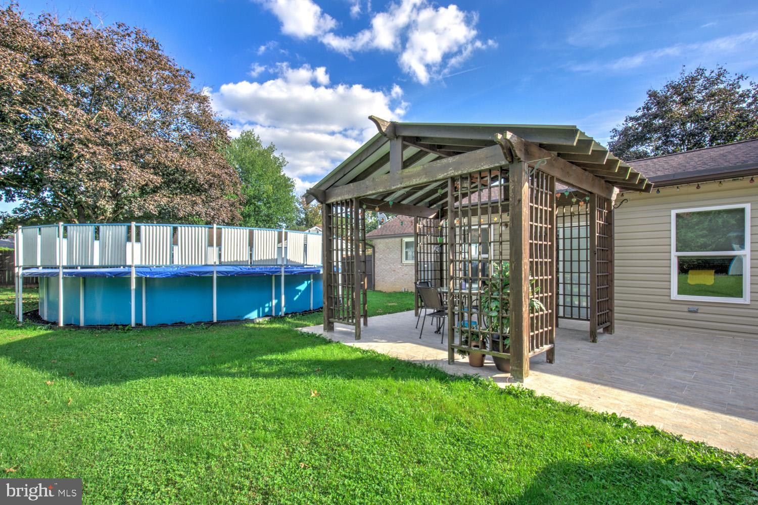 912 Perry Road Lititz, PA 17543 - Photo 4 of 50 a view of a chair and table with wooden fence