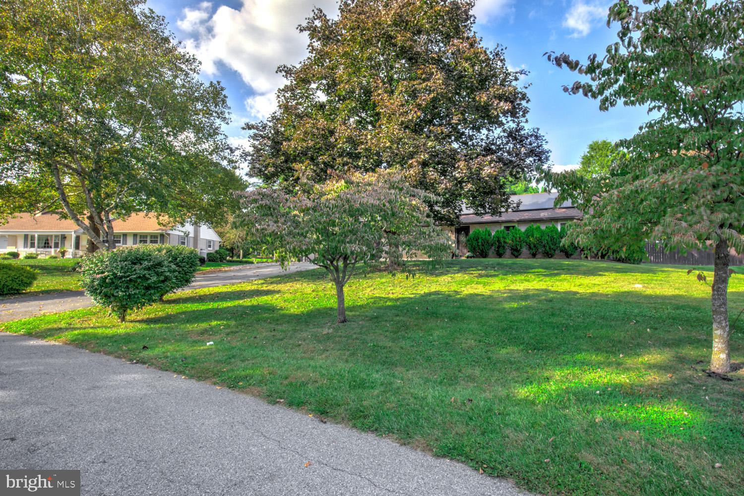 912 Perry Road Lititz, PA 17543 - Photo 42 of 50 a view of a swimming pool in a yard with palm trees