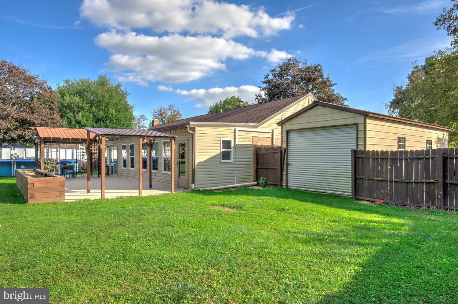 912 Perry Road Lititz, PA 17543 - Photo 47 of 50 a view of a house with a yard and sitting area