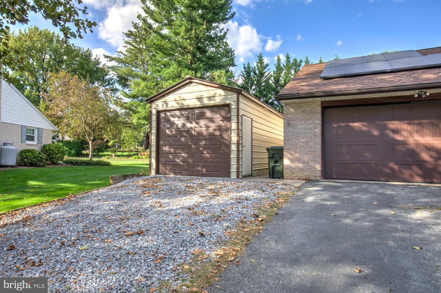 912 Perry Road Lititz, PA 17543 - Photo 48 of 50 a view of a house with a yard and garage