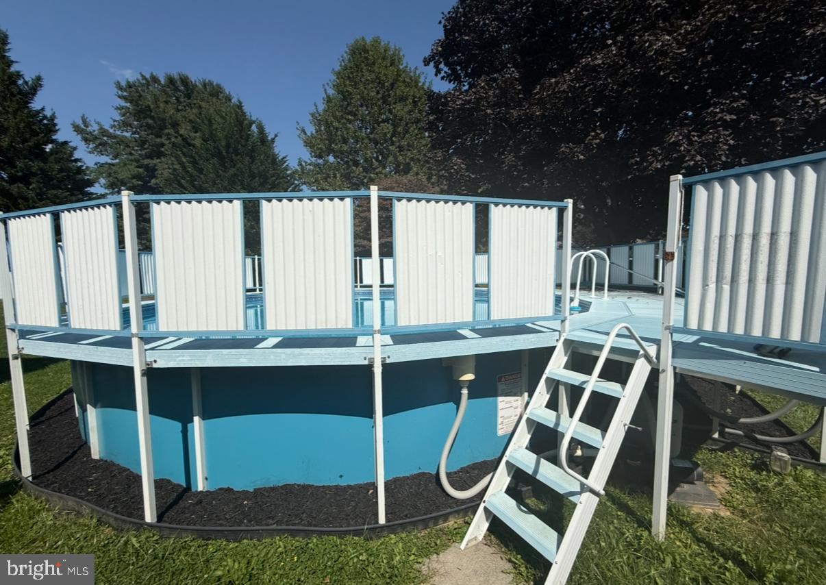 912 Perry Road Lititz, PA 17543 - Photo 50 of 50 a view of a backyard with table and chairs with wooden fence and plants