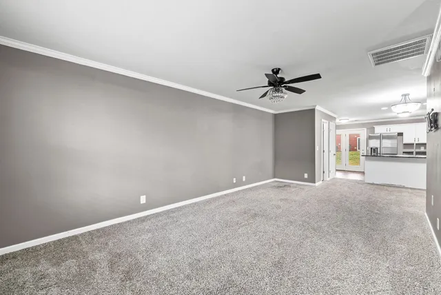 a view of a livingroom with a ceiling fan