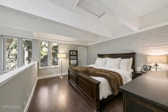 a view of a house with a garden and deck