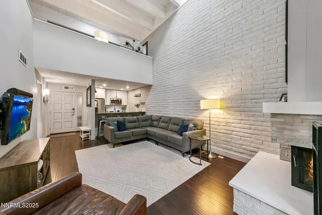 a kitchen with stainless steel appliances a stove a microwave and a refrigerator