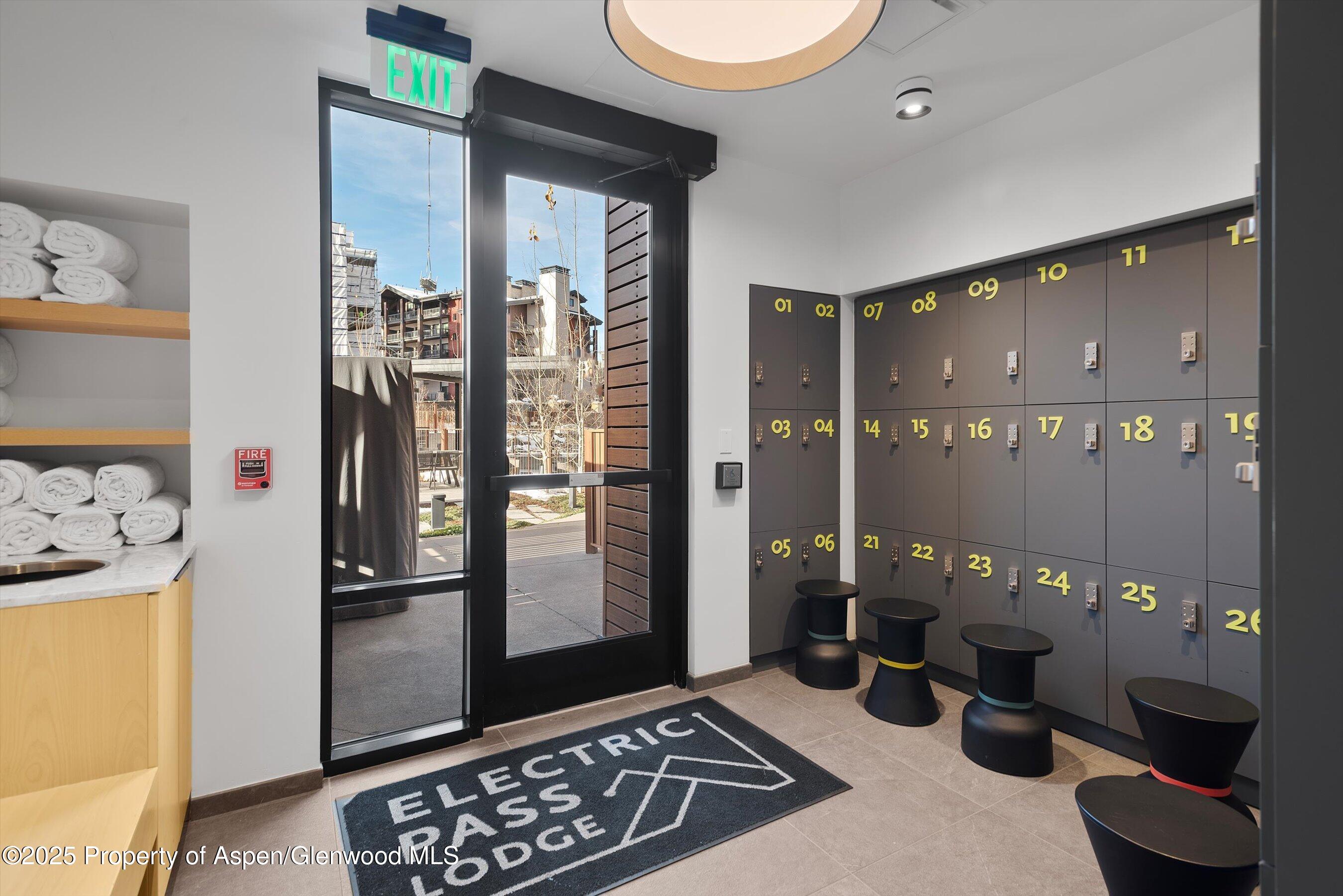 119 Wood Road, Unit 303 Snowmass Village, CO 81615 - Photo 17 of 30 a view of a livingroom with furniture and front door