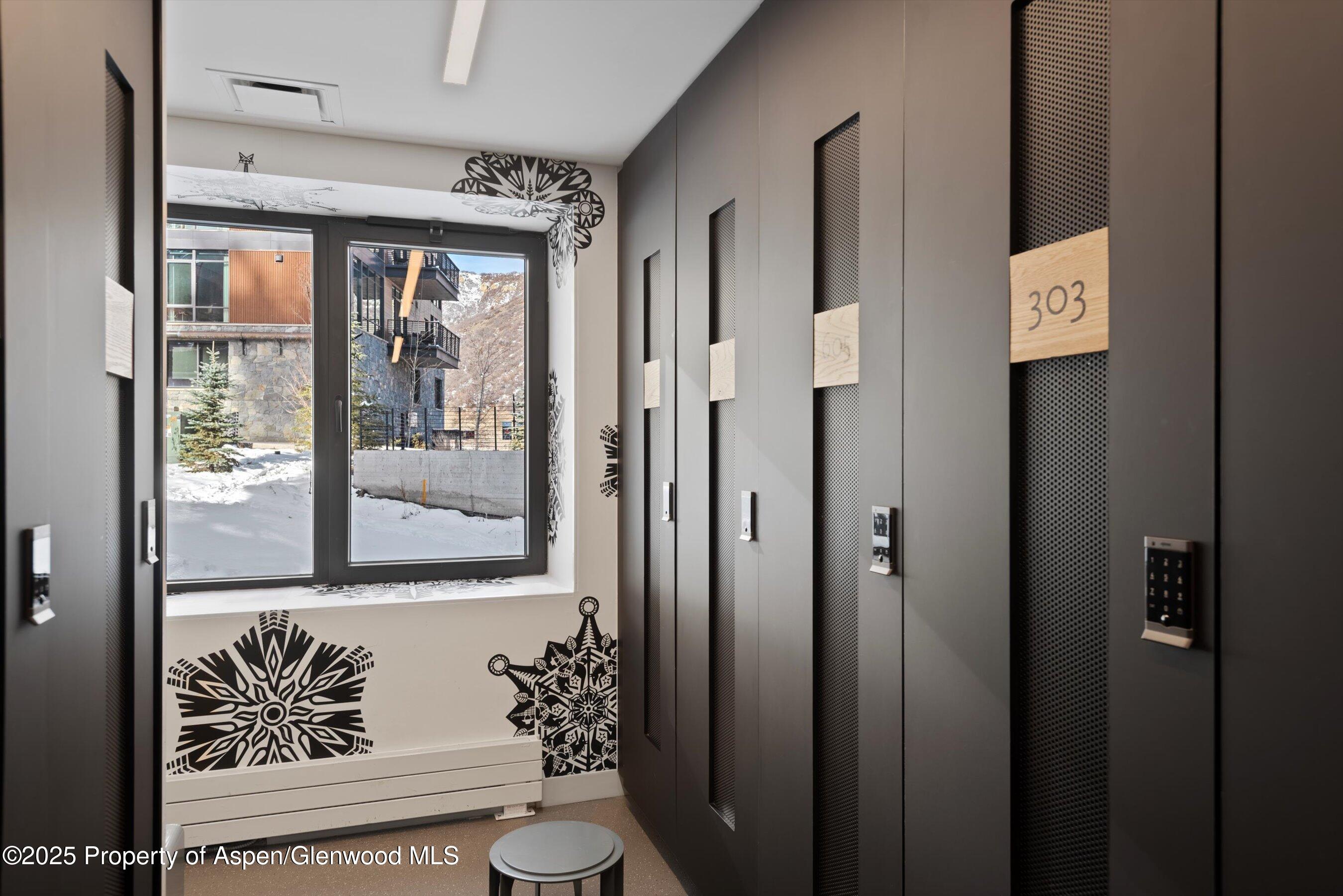 119 Wood Road, Unit 303 Snowmass Village, CO 81615 - Photo 24 of 30 a view of back door of the house and wooden door