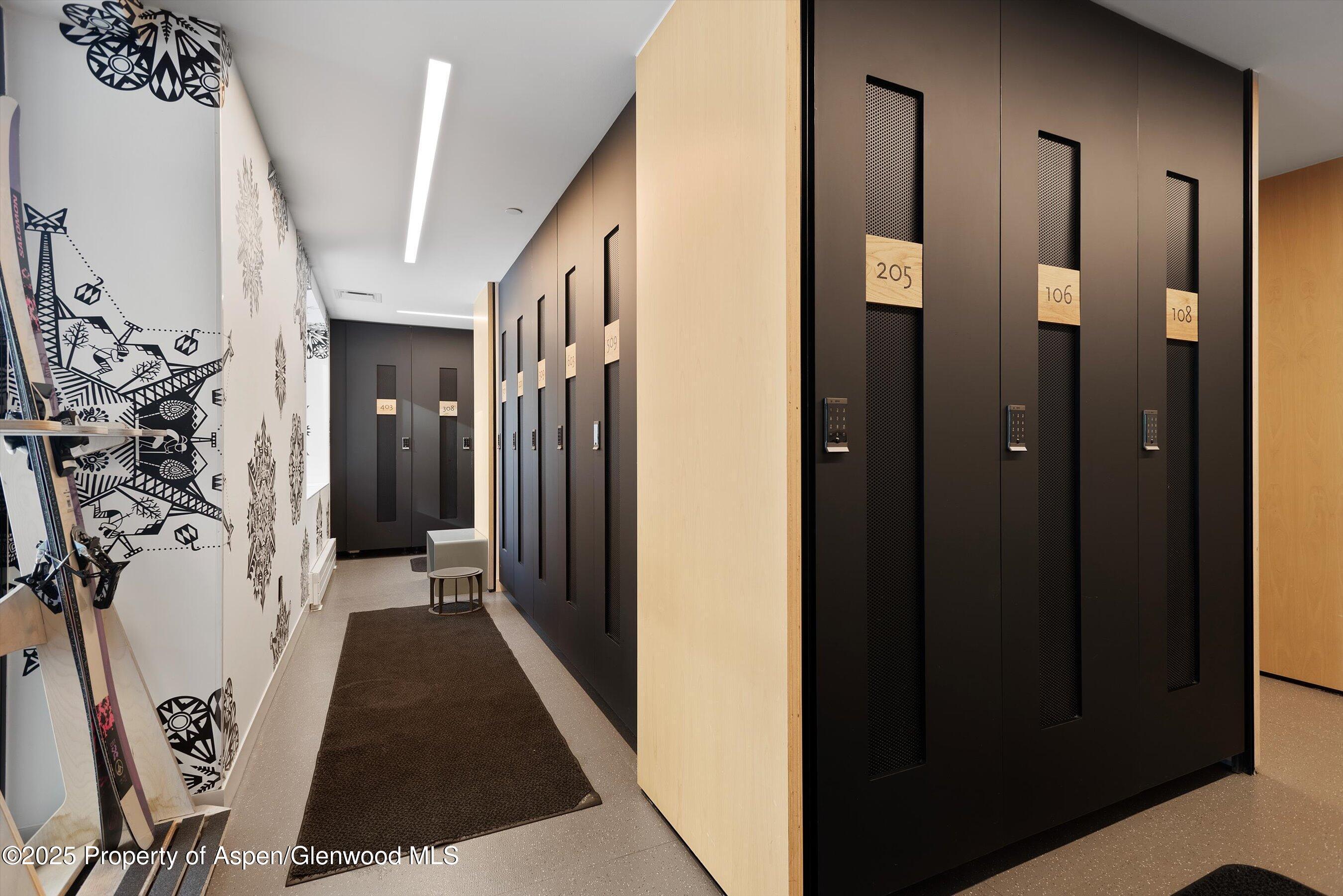 119 Wood Road, Unit 303 Snowmass Village, CO 81615 - Photo 25 of 30 a view of a hallway with wooden shelves