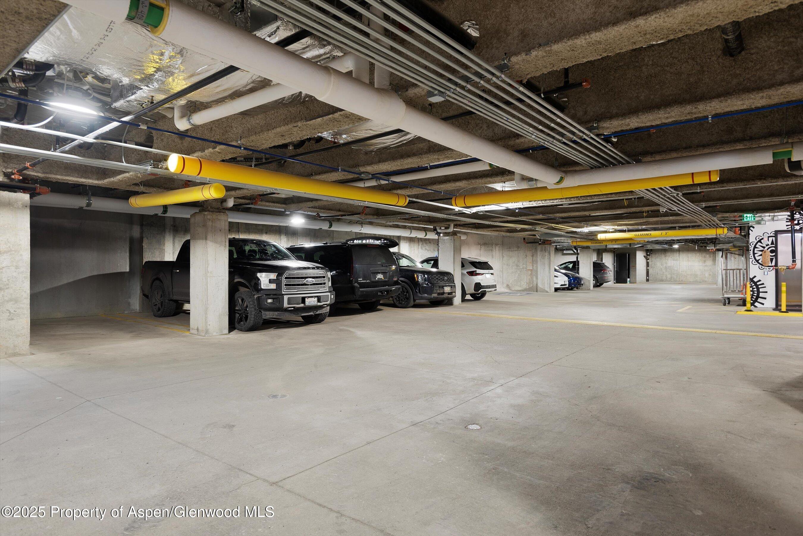 119 Wood Road, Unit 303 Snowmass Village, CO 81615 - Photo 30 of 30 a view of parking garage with cars