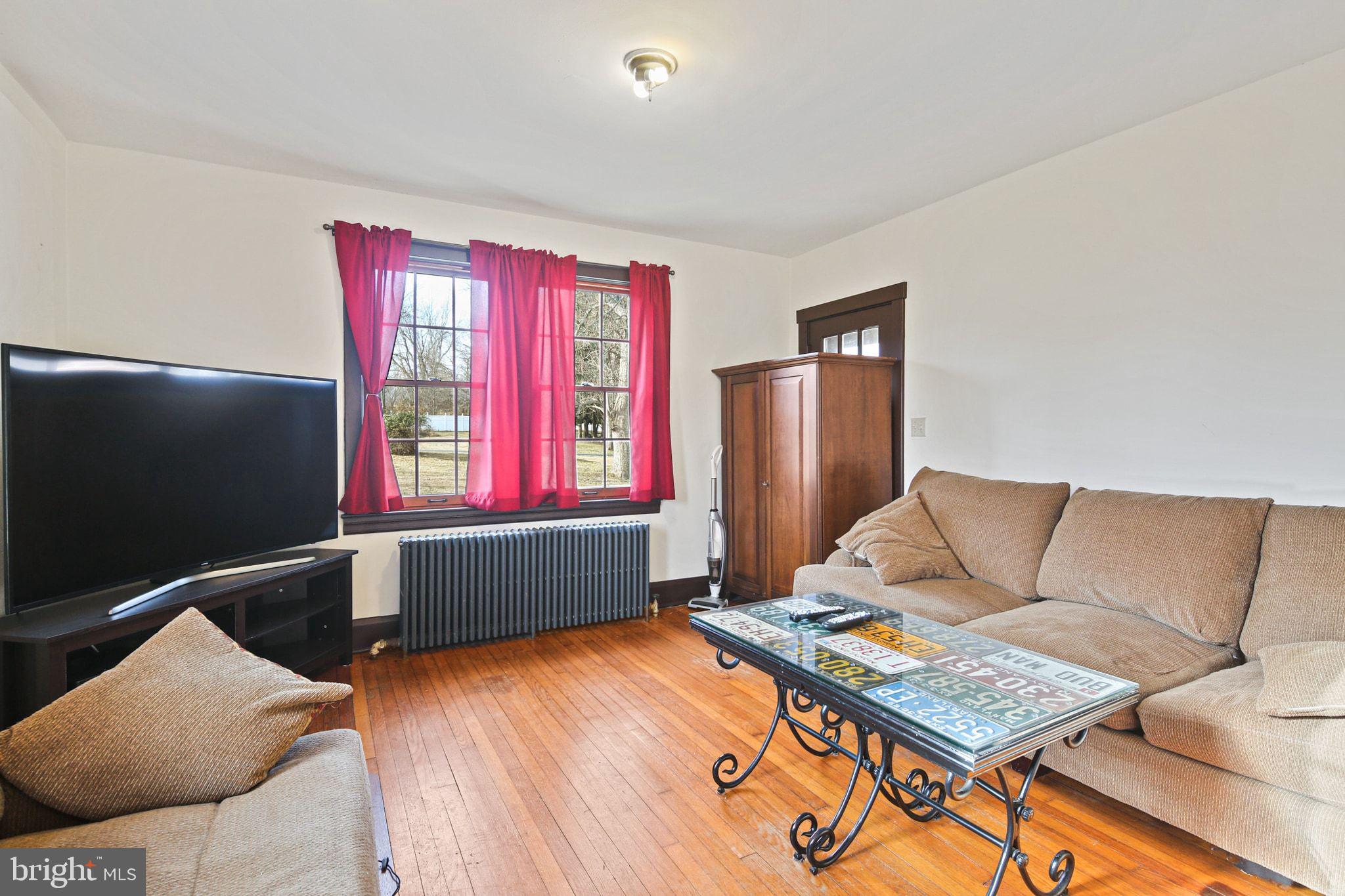 11850 Ramsburg Road Marriottsville, MD 21104 - Photo 15 of 49 a living room with furniture and a flat screen tv