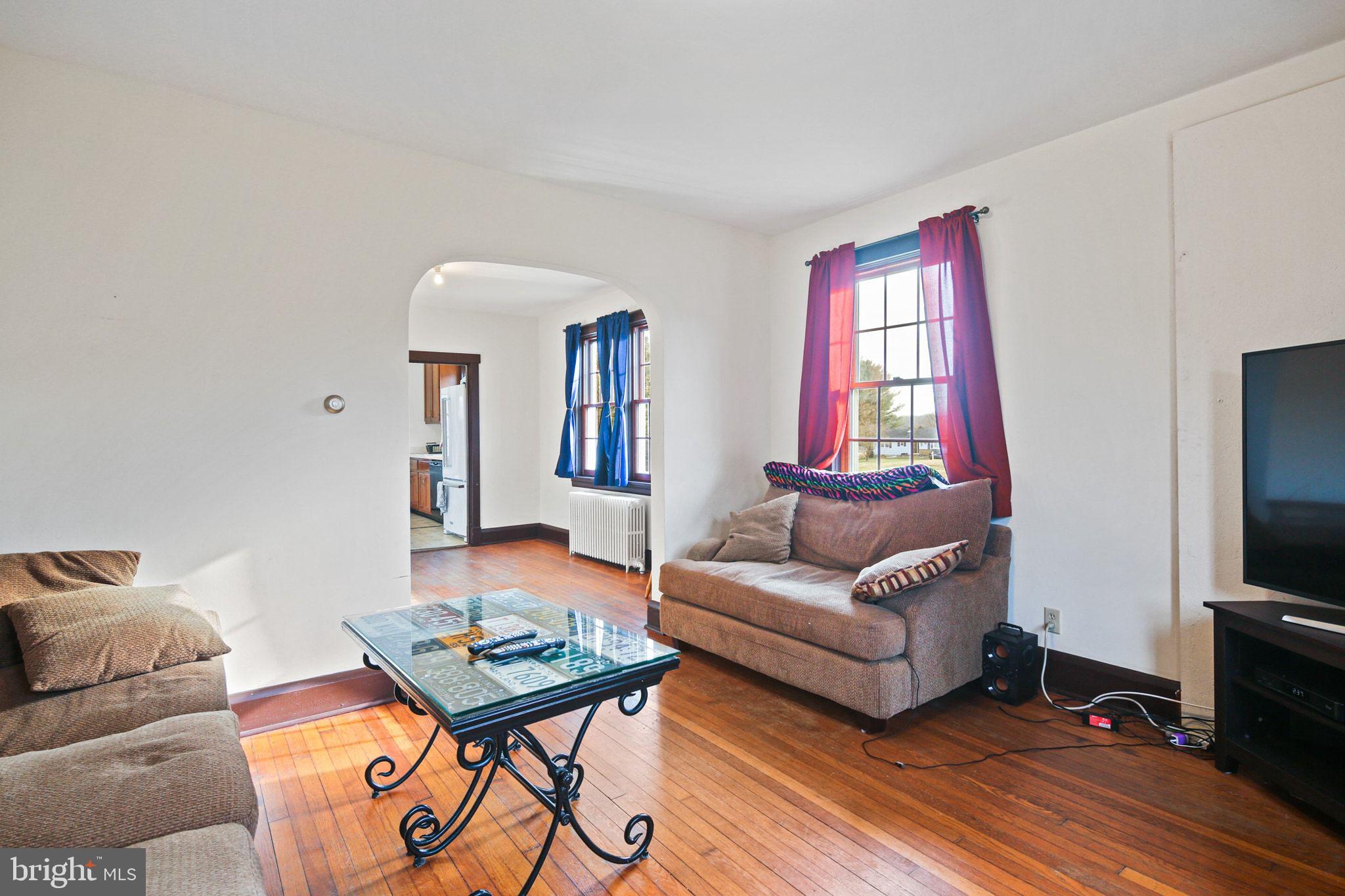 11850 Ramsburg Road Marriottsville, MD 21104 - Photo 16 of 49 a living room with furniture and a flat screen tv