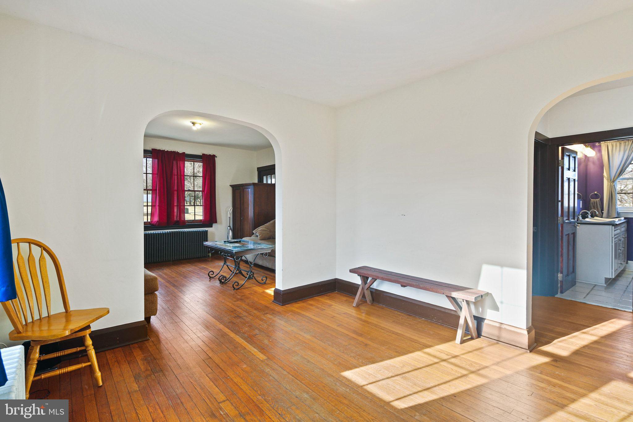 11850 Ramsburg Road Marriottsville, MD 21104 - Photo 18 of 49 a spacious bedroom with a bed and wooden floor