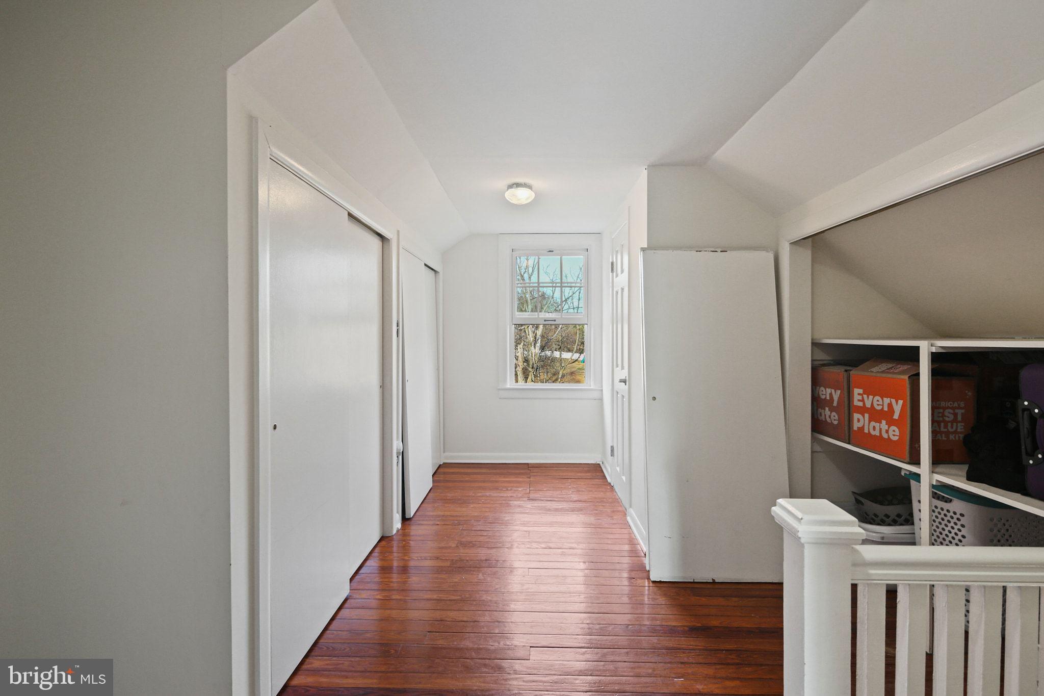 11850 Ramsburg Road Marriottsville, MD 21104 - Photo 29 of 49 a view of a hallway with wooden floor and stairs