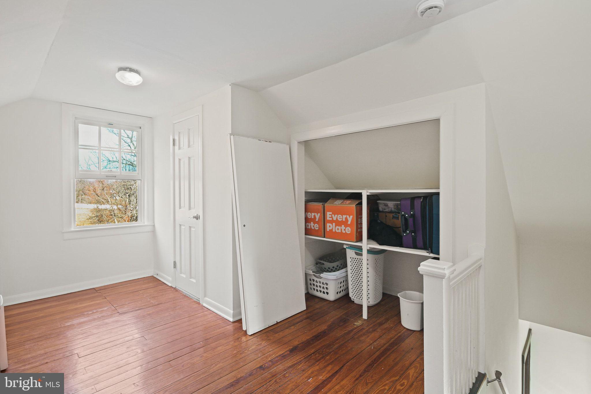 11850 Ramsburg Road Marriottsville, MD 21104 - Photo 30 of 49 an empty room with wooden floor and windows