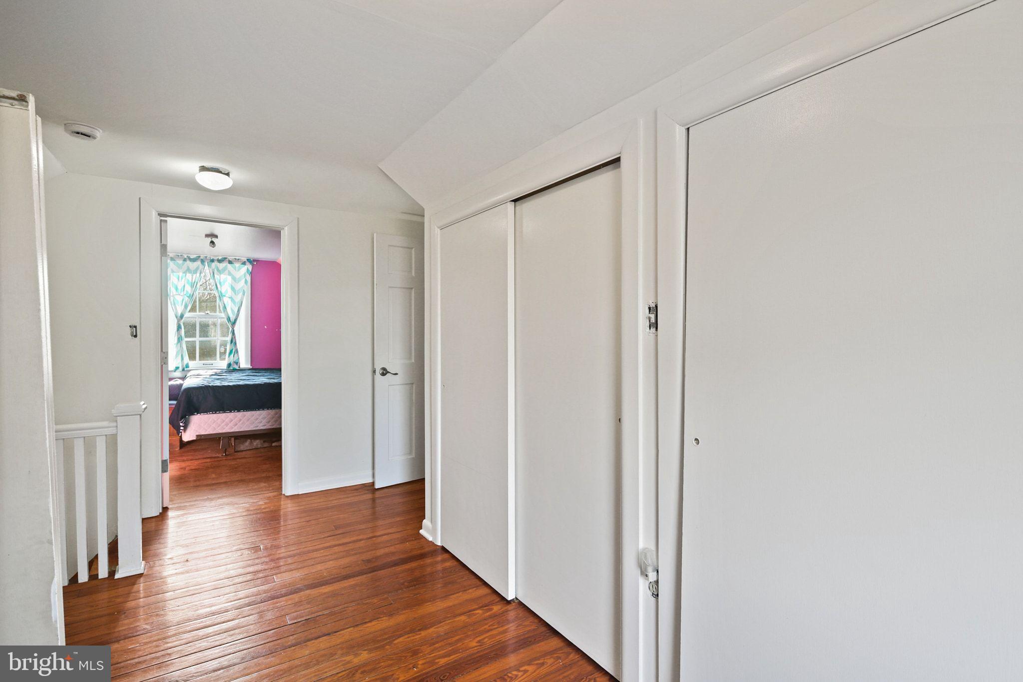 11850 Ramsburg Road Marriottsville, MD 21104 - Photo 31 of 49 a view of a hallway with wooden floor and closet
