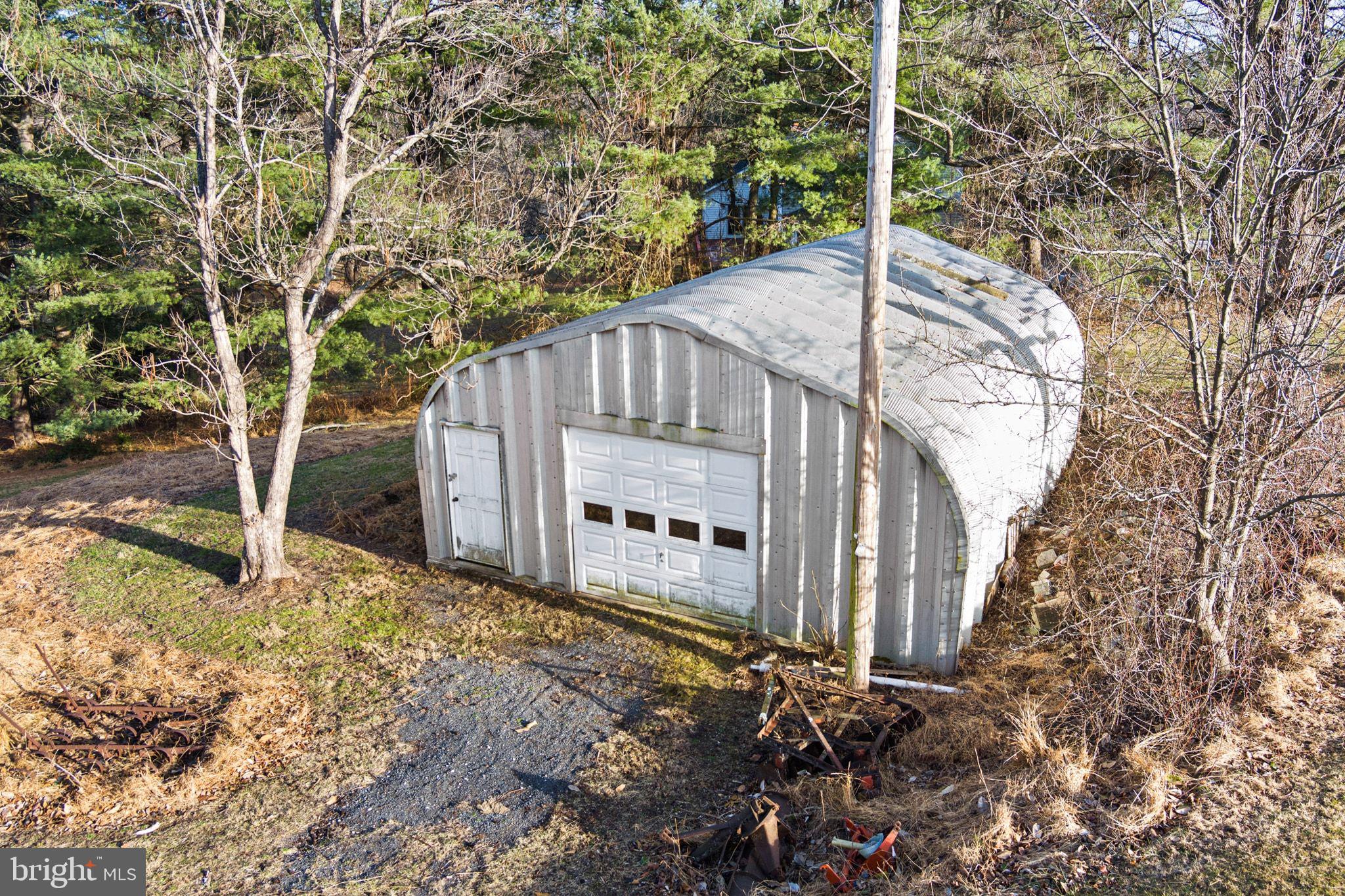 11850 Ramsburg Road Marriottsville, MD 21104 - Photo 34 of 49 a view of a house with a yard