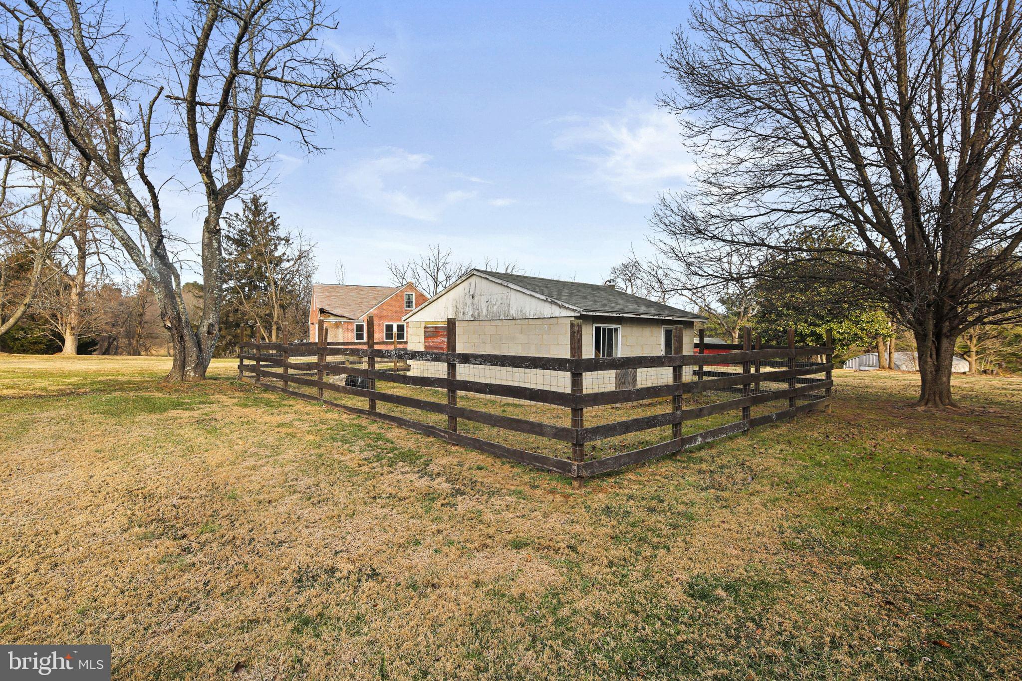 11850 Ramsburg Road Marriottsville, MD 21104 - Photo 43 of 49 a white house covered with snow in the background