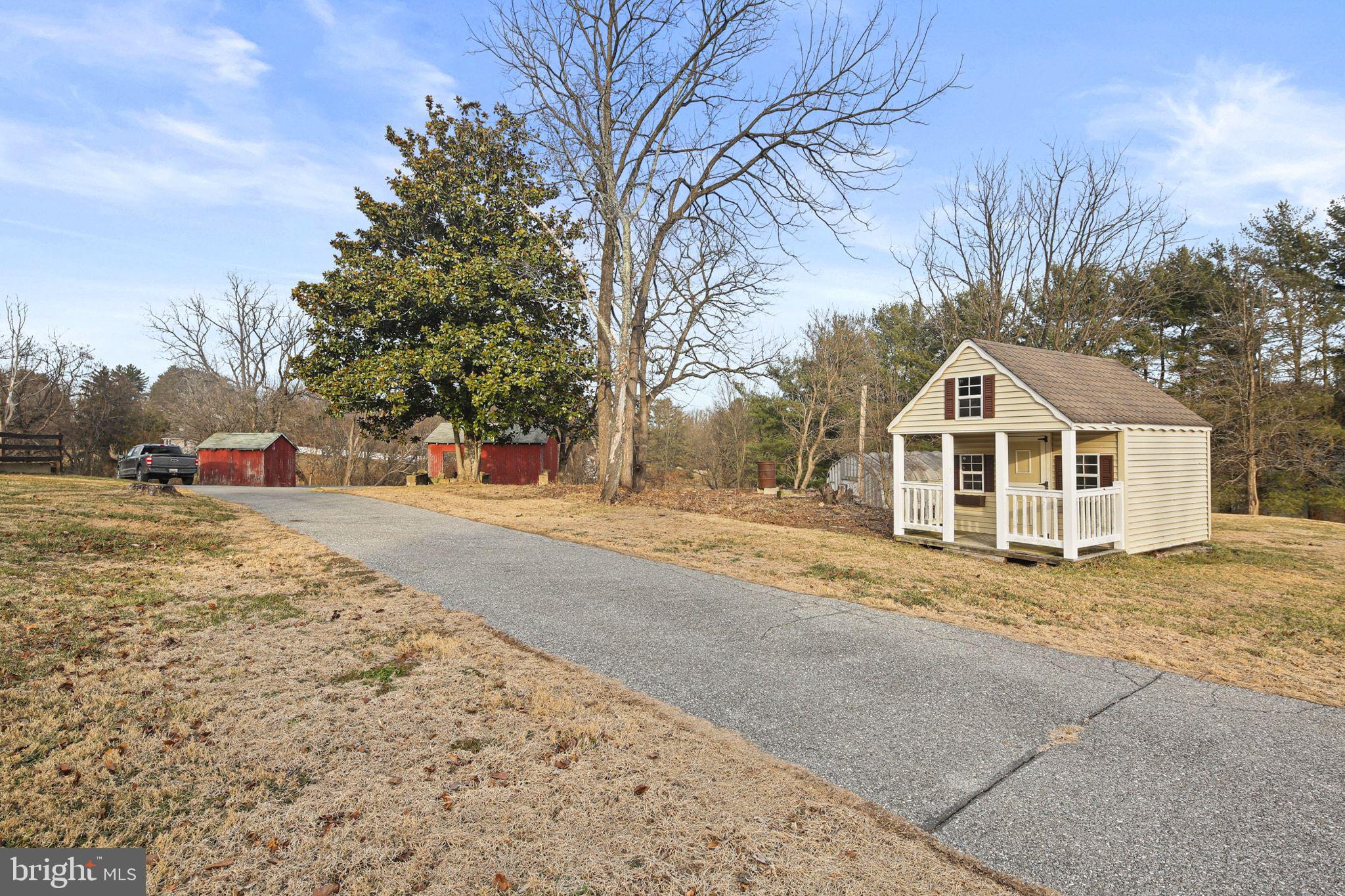 11850 Ramsburg Road Marriottsville, MD 21104 - Photo 45 of 49 a view of white house with a yard covered with snow