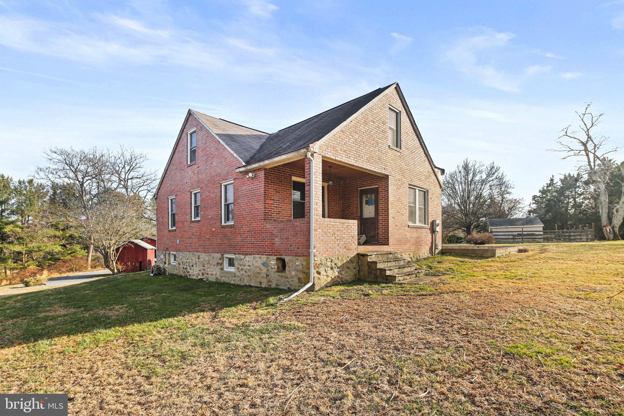 11850 Ramsburg Road Marriottsville, MD 21104 - Photo 7 of 49 a view of a house with a yard