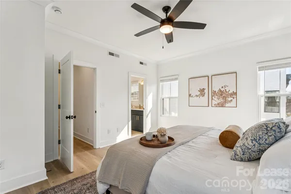 a bedroom with bed and a window