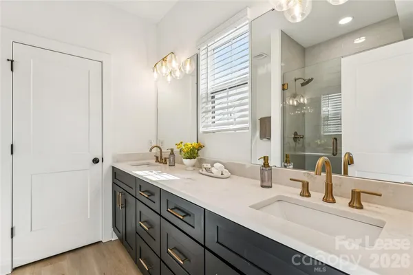 a bathroom with a shower and a sink
