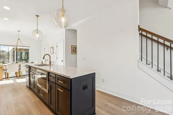 a living room with furniture and two window
