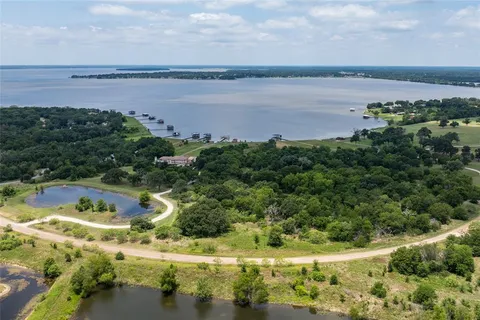 a view of a lake with a yard