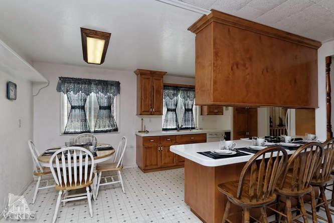 1702 Fitzgerald Road Simi Valley, CA 93065 - Photo 4 of 12 a kitchen that has a table and chairs in it