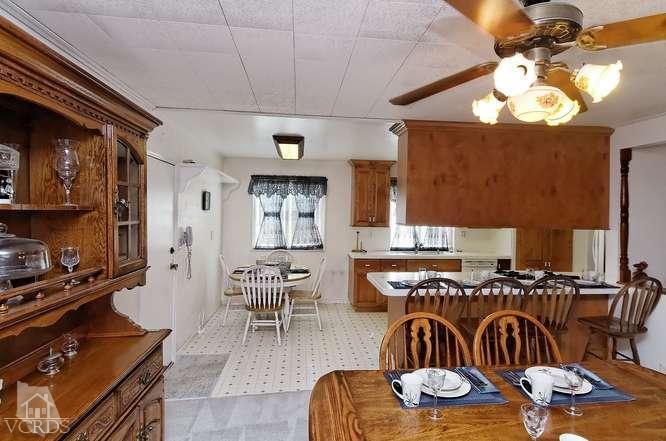 1702 Fitzgerald Road Simi Valley, CA 93065 - Photo 5 of 12 a dinning room with furniture kitchen view and a chandelier