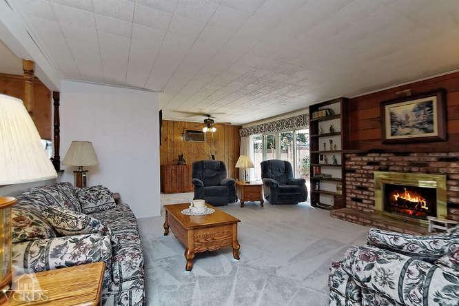 1702 Fitzgerald Road Simi Valley, CA 93065 - Photo 7 of 12 a bedroom with furniture and a fireplace