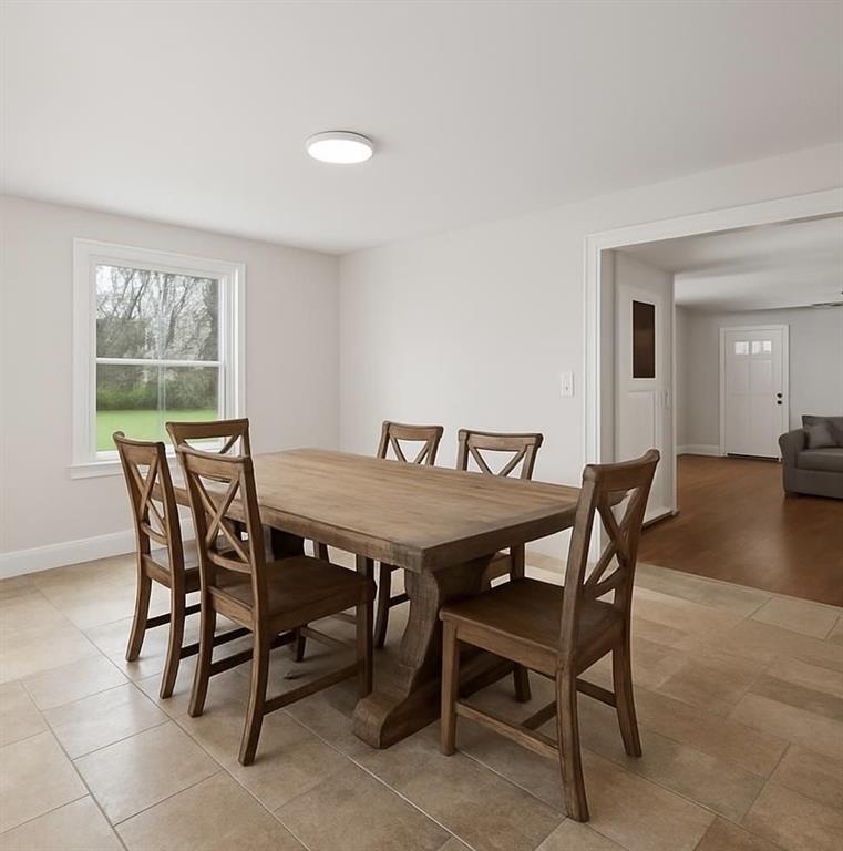 6012 Cunningham Road Gibsonia, PA 15044 - Photo 10 of 26 Dining room currently fits an air hockey table. This is an enhanced image to show it with a table.