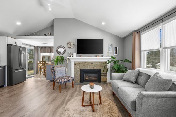16 Hazelwood Road Dennis, MA 02660 - Photo 8 of 40 a living room with furniture a flat screen tv and a fireplace