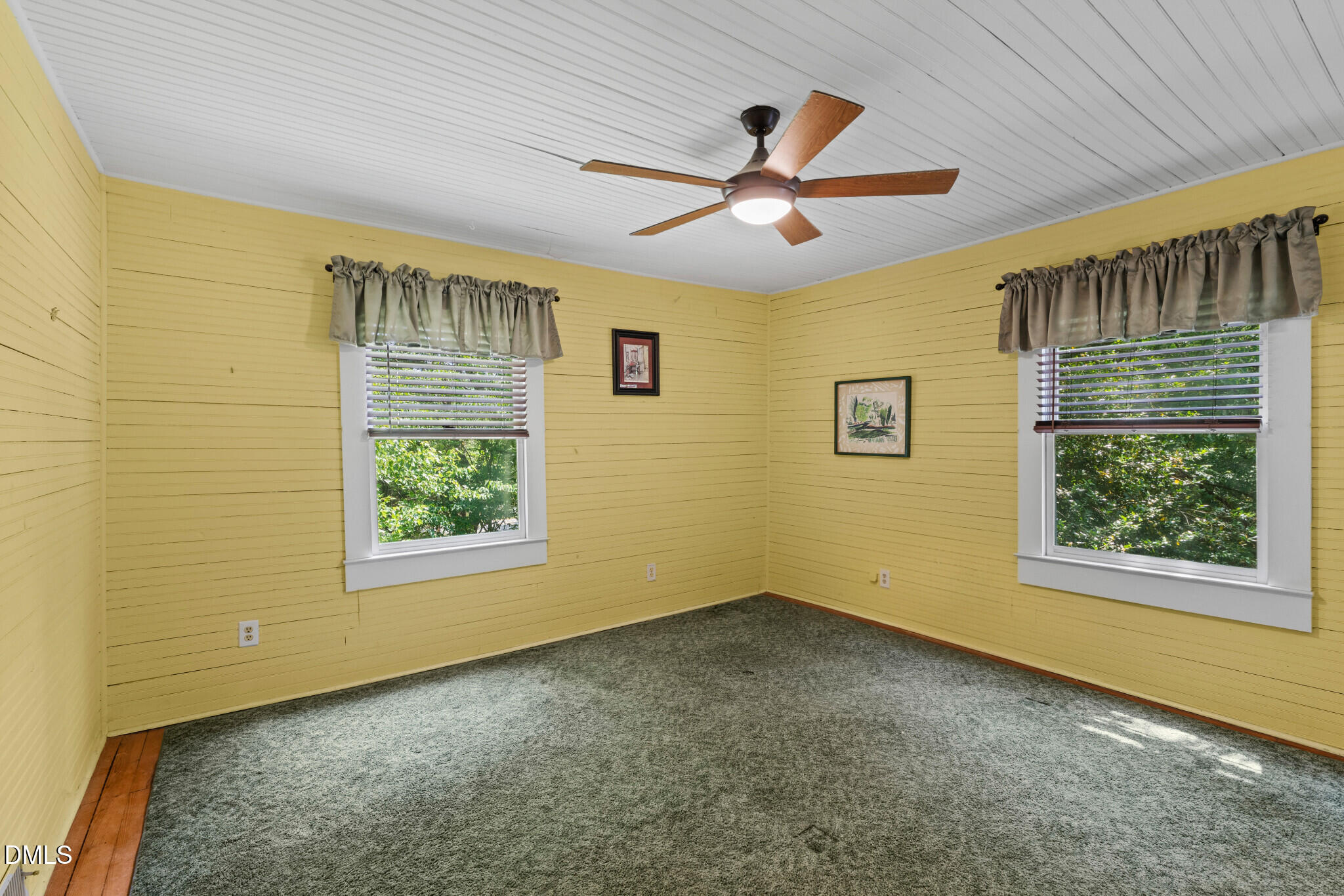 3415 Mt Willing Road Efland, NC 27243 - Photo 13 of 36 a view of an empty room with chandelier fan and fire place