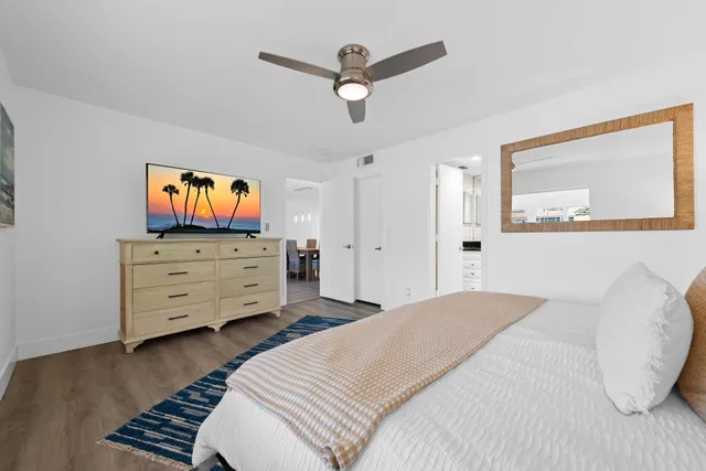 a bed room with a bed and a television