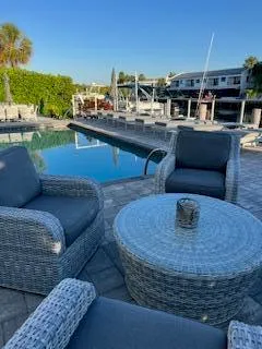 a living room with furniture and a kitchen view