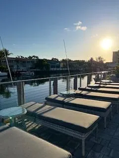 a terrace with barbeque oven and outdoor seating