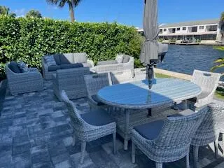 a view of an outdoor sitting area with furniture