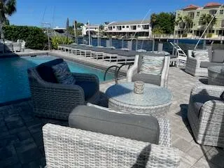 a view of roof deck with seating space and trees