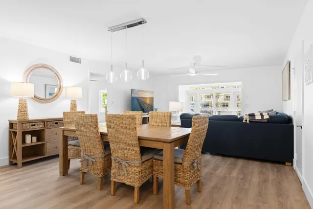 a living room with dining table and chairs