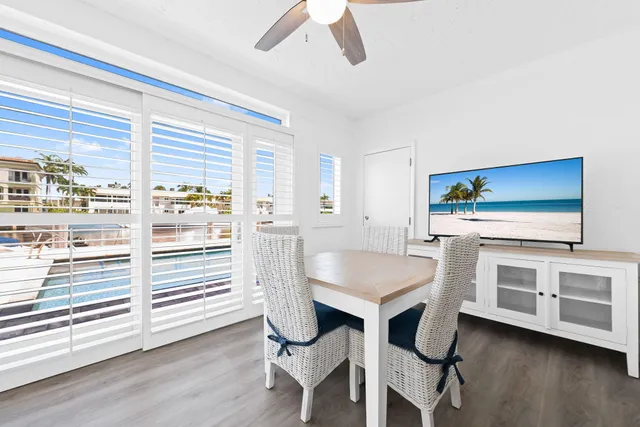 a kitchen with a table and chairs