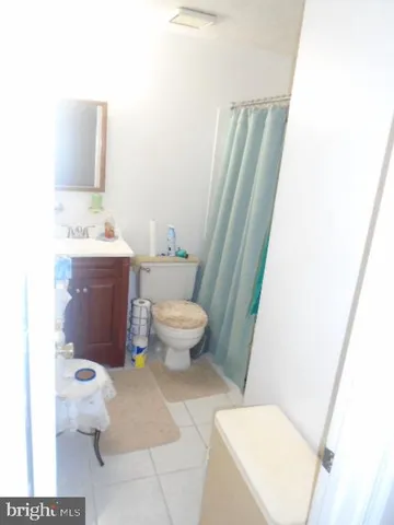a bathroom with a toilet and a sink